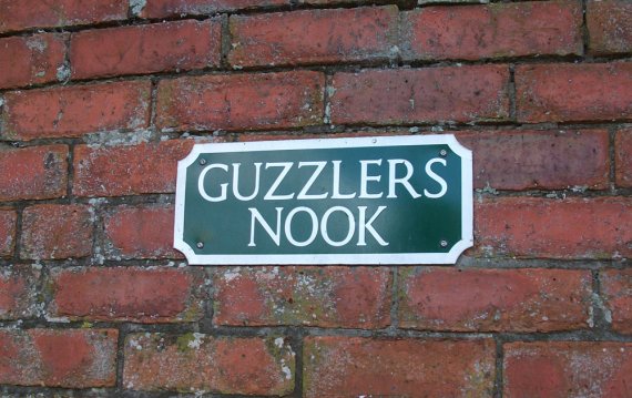 "Guzzler's Nook" sign